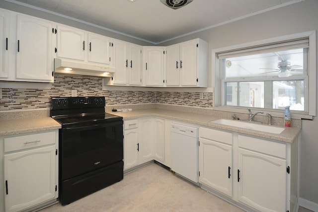 kitchen with backsplash, white dishwasher, black range with electric stovetop, sink, and white cabinetry