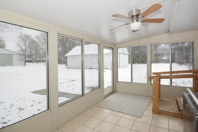 unfurnished sunroom with ceiling fan and lofted ceiling