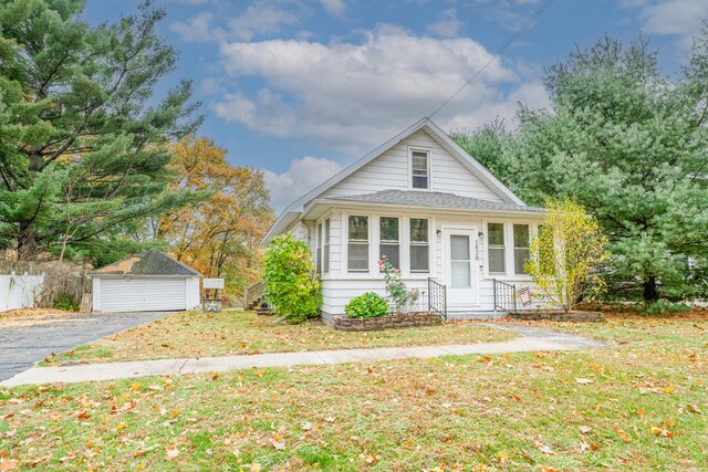 1820 River Bluff Rd, Niles, MI 49120 - bungalow with an outdoor structure, a front yard, a garage, and a shingled roof