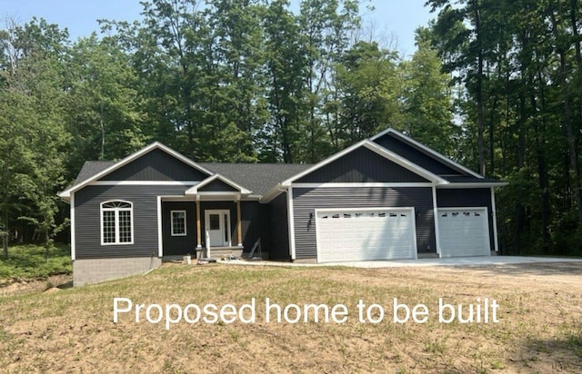 view of front facade with a front yard and a garage