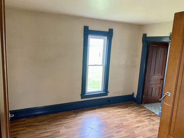 unfurnished room featuring hardwood / wood-style floors