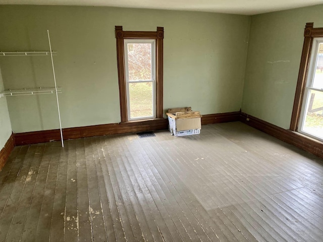 unfurnished room with hardwood / wood-style floors