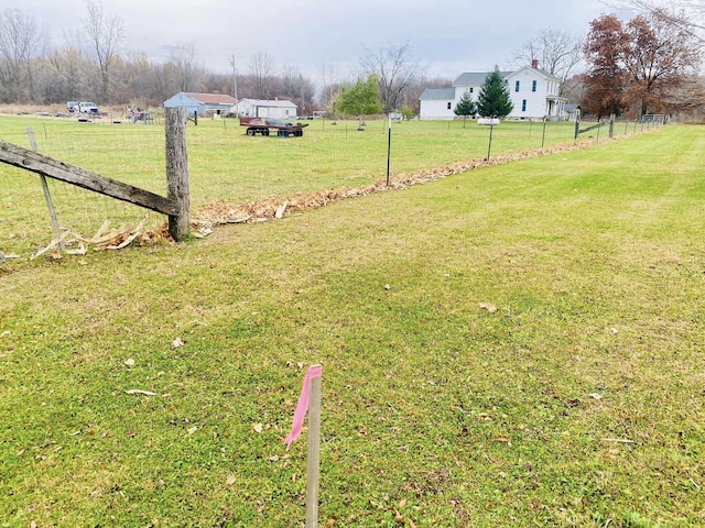 view of yard with a rural view