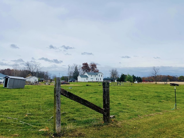 view of yard with a rural view