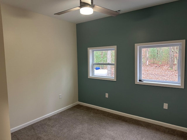 carpeted empty room with ceiling fan