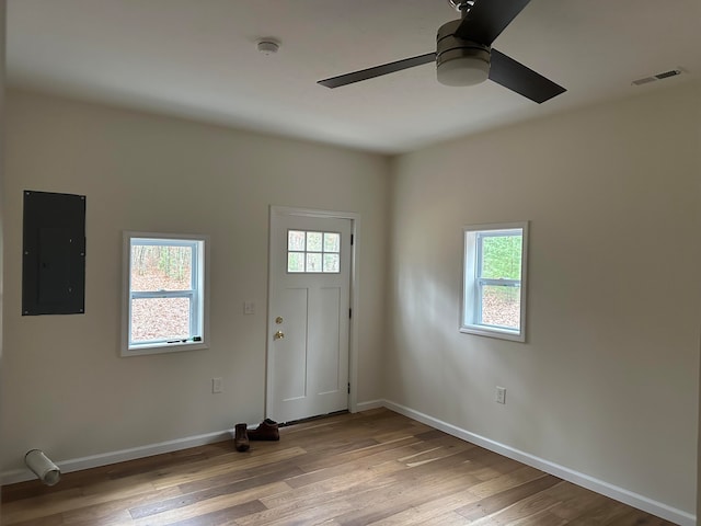 entrance foyer featuring electric panel, light hardwood / wood-style floors, and ceiling fan