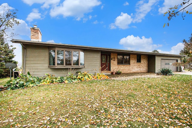 ranch-style house featuring a garage and a front lawn