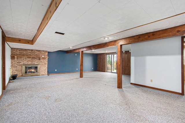 basement with carpet and a fireplace