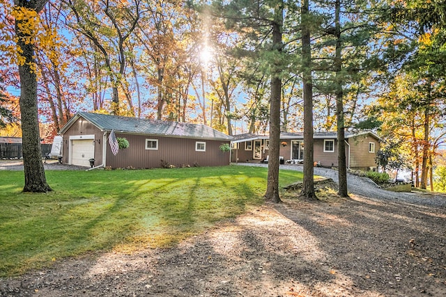 exterior space featuring a garage and a front yard