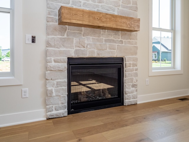 room details featuring hardwood / wood-style floors and a fireplace