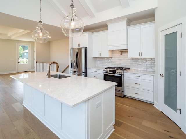 kitchen featuring white cabinets, stainless steel appliances, and beam ceiling