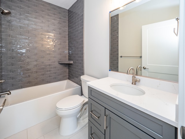 full bathroom featuring tile patterned floors, vanity, tiled shower / bath combo, and toilet