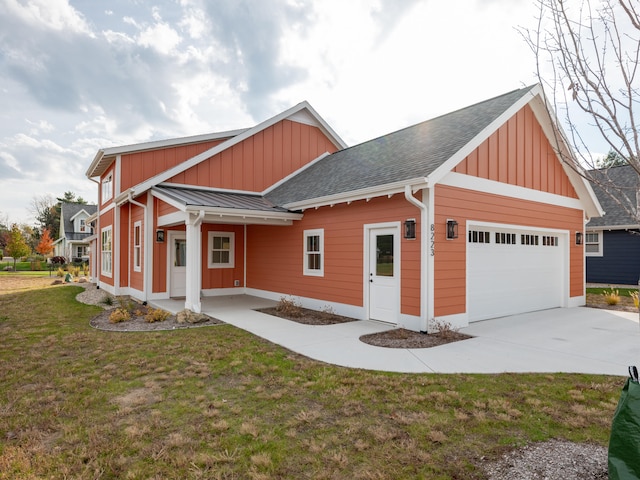 exterior space with a garage and a yard