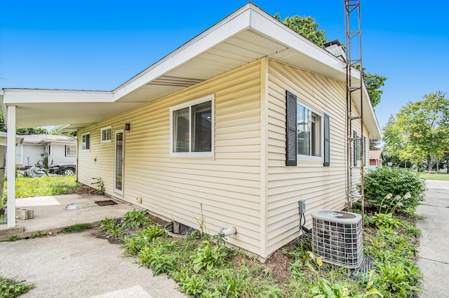 view of side of property featuring central AC