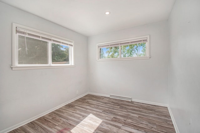 unfurnished room with light hardwood / wood-style flooring