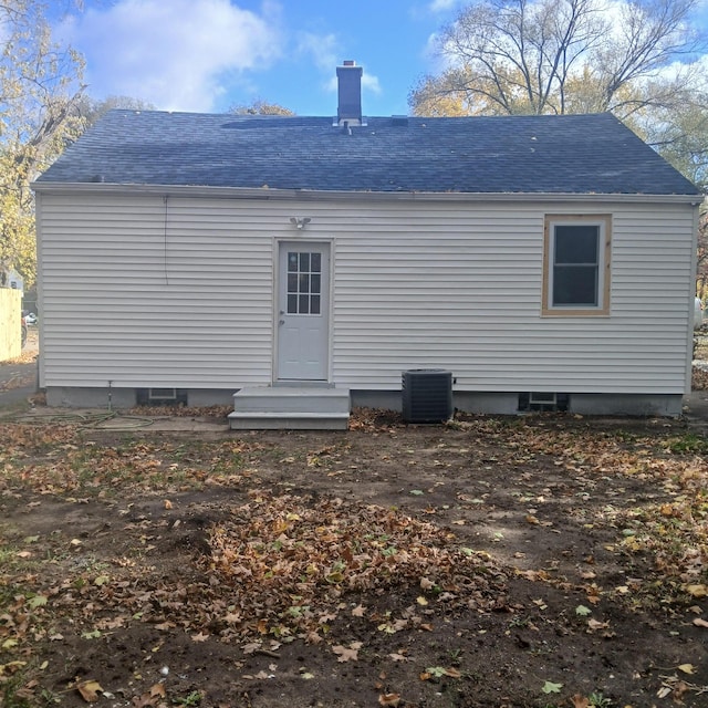 back of house featuring cooling unit