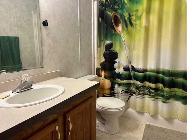 full bathroom featuring toilet, vanity, shower / bath combination with curtain, and tile patterned floors