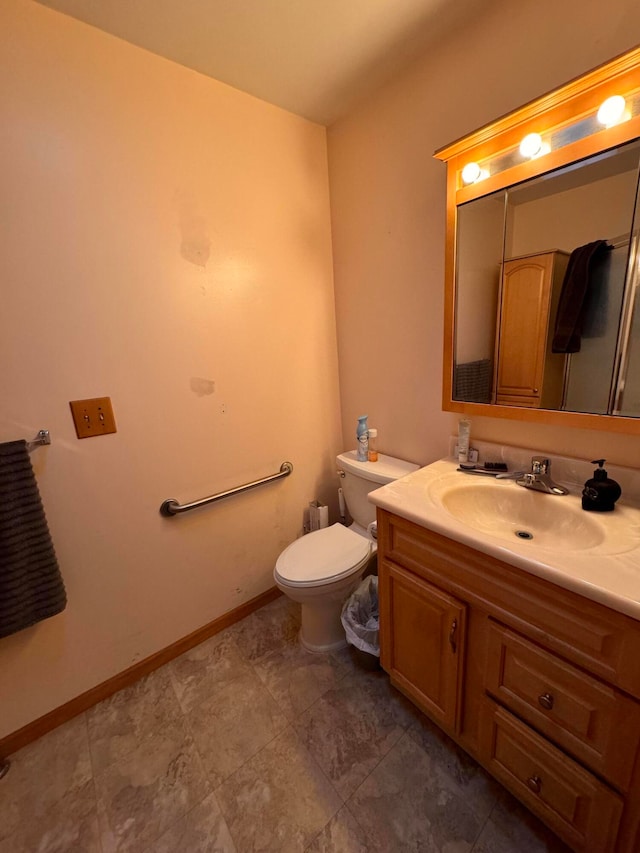 bathroom with toilet and vanity