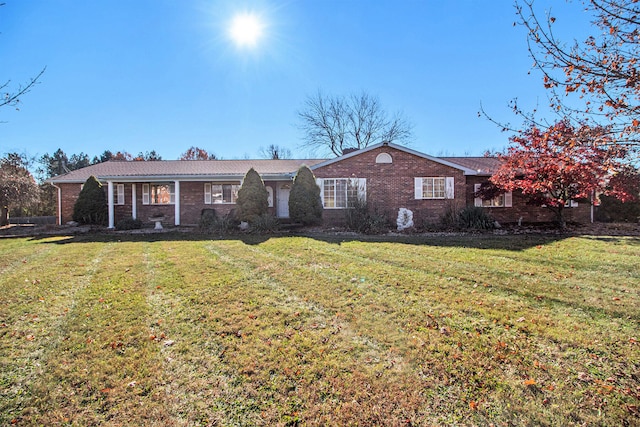 ranch-style house with a front lawn