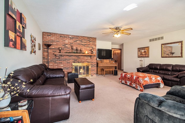 living room featuring a brick fireplace, ceiling fan, and carpet floors