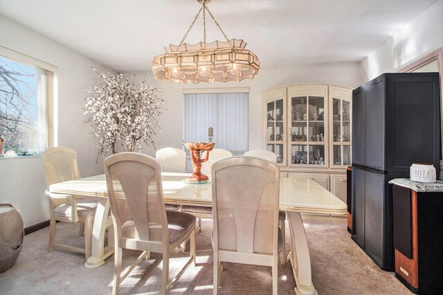 dining area with carpet flooring