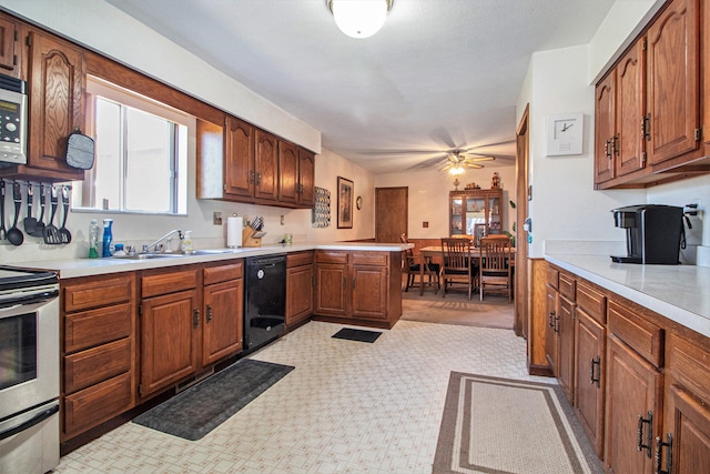 kitchen with kitchen peninsula, ceiling fan, sink, and appliances with stainless steel finishes