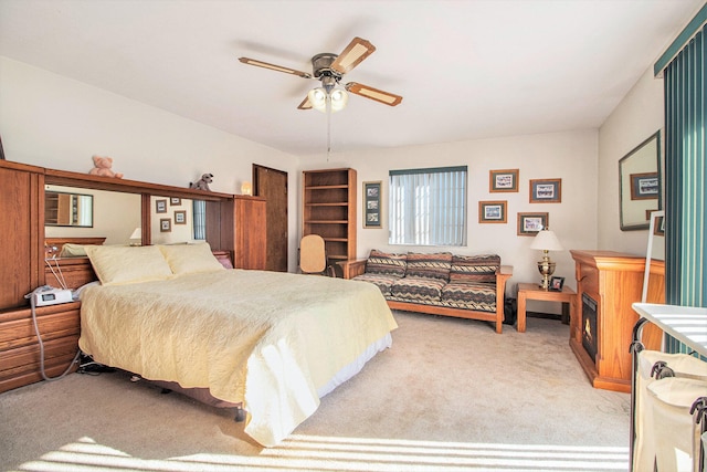 bedroom with light carpet and ceiling fan