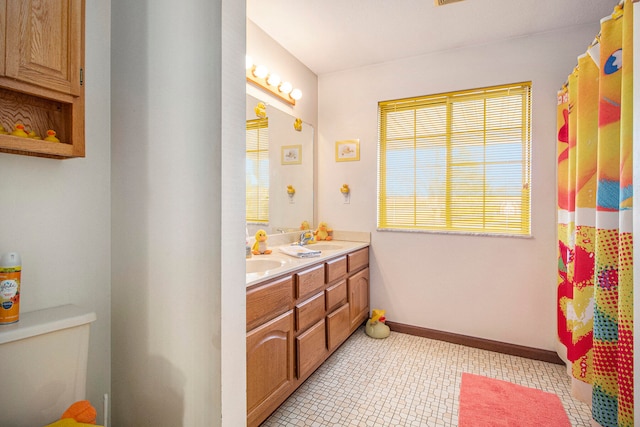 bathroom with vanity, toilet, and a shower with shower curtain