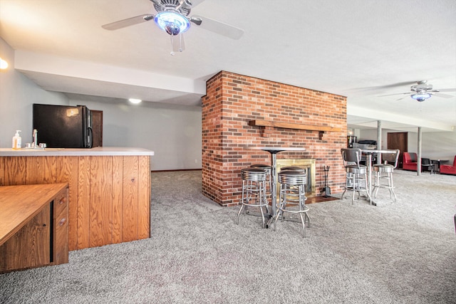 bar with ceiling fan, light colored carpet, a textured ceiling, and black fridge