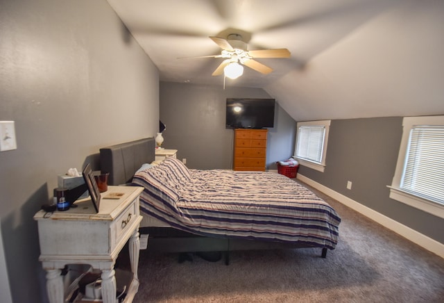 carpeted bedroom featuring multiple windows, ceiling fan, and lofted ceiling