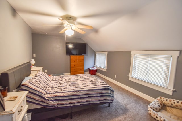 carpeted bedroom featuring ceiling fan and vaulted ceiling