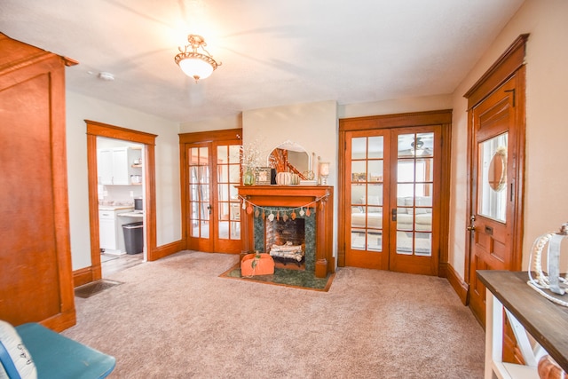 carpeted living room with french doors