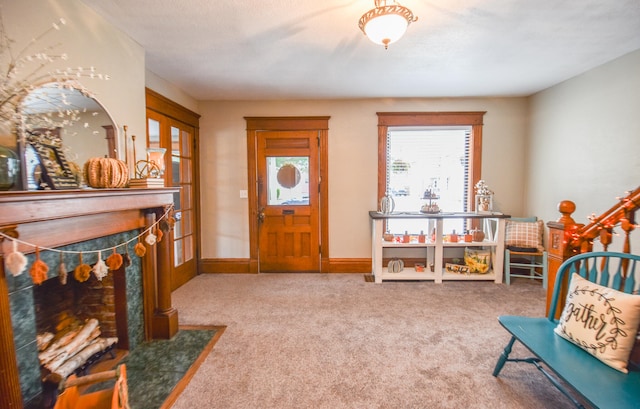 sitting room featuring french doors and carpet