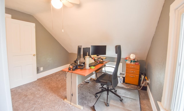 office area with ceiling fan, lofted ceiling, and light carpet