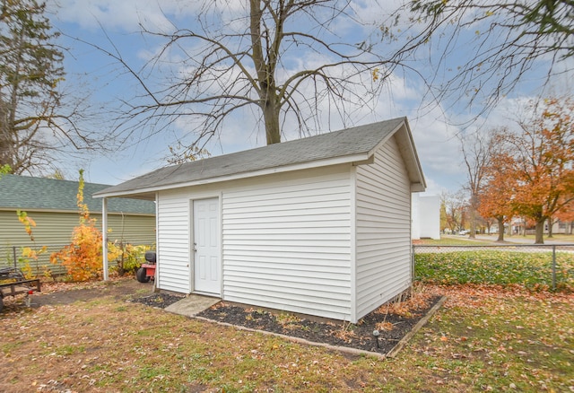 view of outbuilding featuring a yard