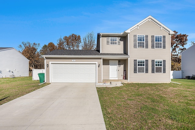 view of front facade with a garage and a front lawn