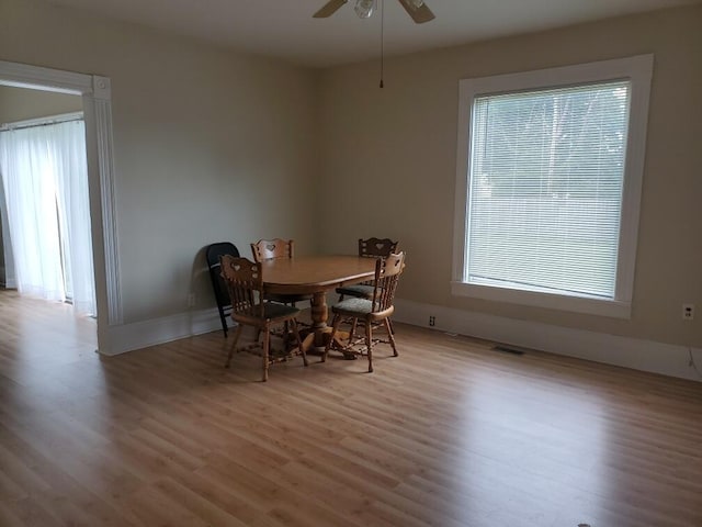 dining room featuring light hardwood / wood-style floors and ceiling fan