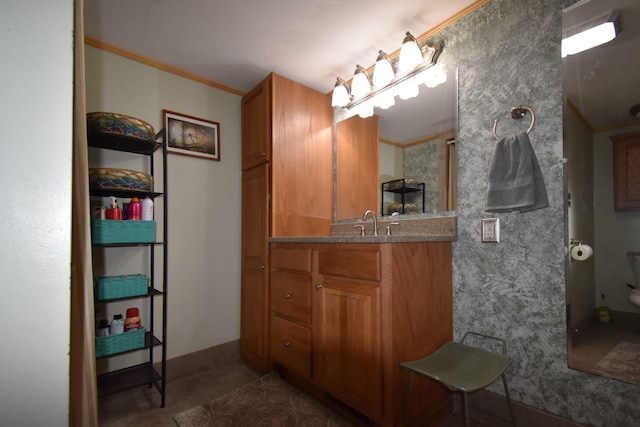 bathroom featuring tile patterned floors, crown molding, vanity, and toilet