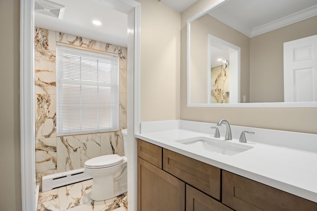 bathroom featuring a baseboard heating unit, toilet, tile walls, ornamental molding, and vanity