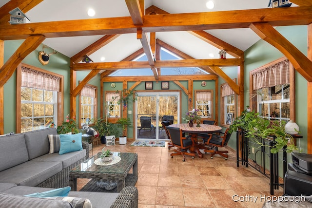 living room featuring beamed ceiling and high vaulted ceiling