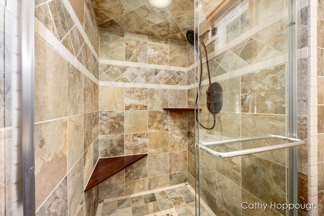 room details featuring a shower with shower door