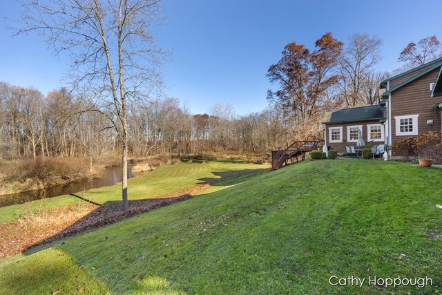 view of yard featuring a wooden deck