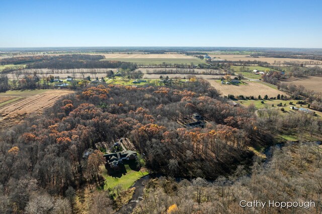 birds eye view of property featuring a rural view