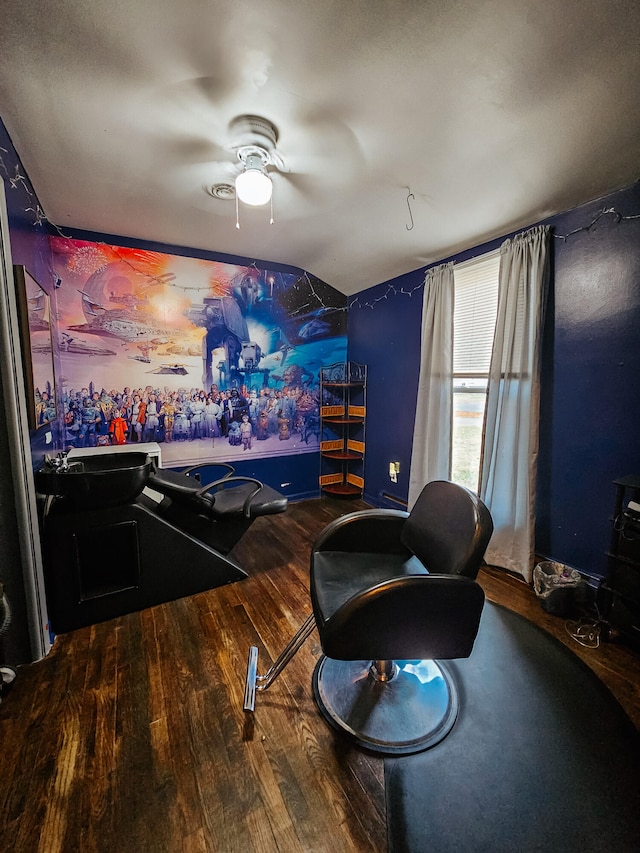 recreation room with ceiling fan, wood-type flooring, and vaulted ceiling