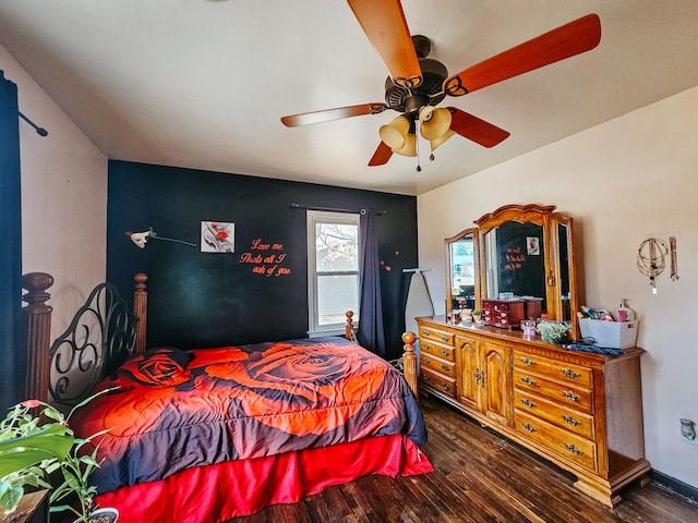 bedroom with ceiling fan and dark hardwood / wood-style floors