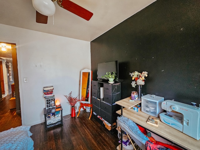 interior space featuring ceiling fan and dark hardwood / wood-style flooring