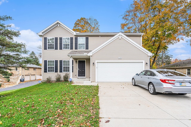 view of front facade featuring a garage and a front lawn