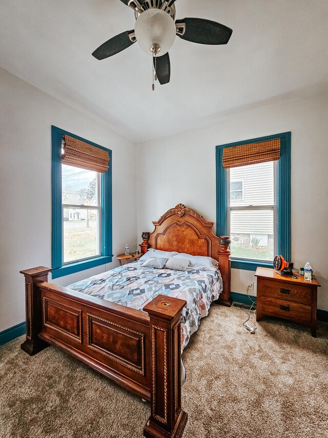 carpeted bedroom featuring ceiling fan