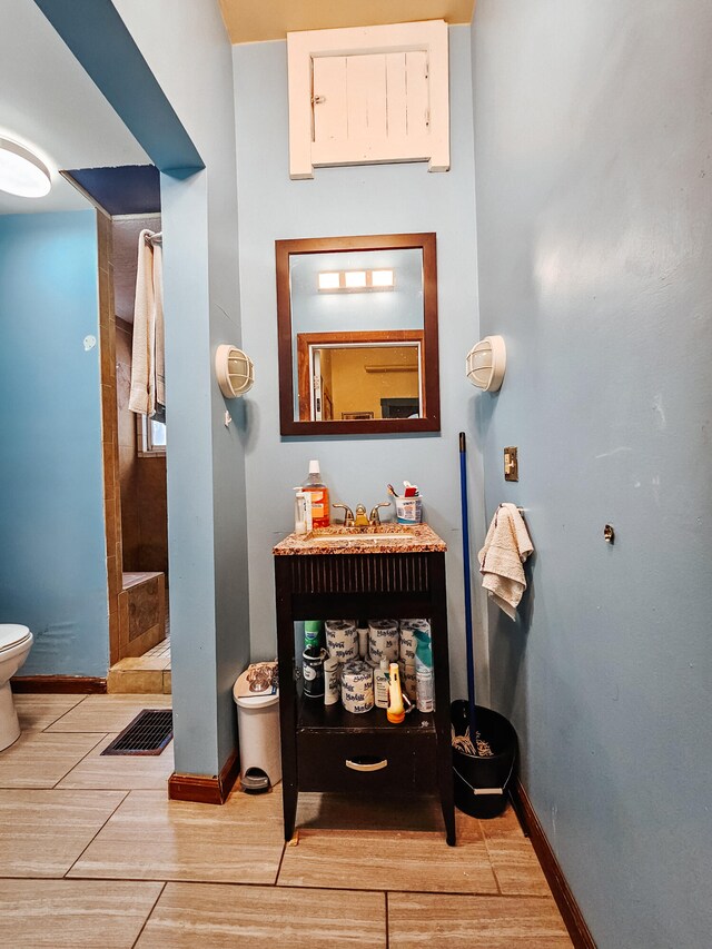 bathroom featuring hardwood / wood-style floors, sink, and toilet