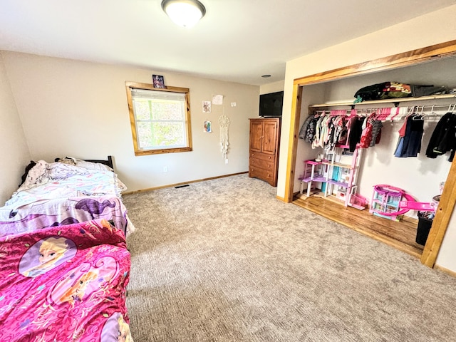 carpeted bedroom with a closet